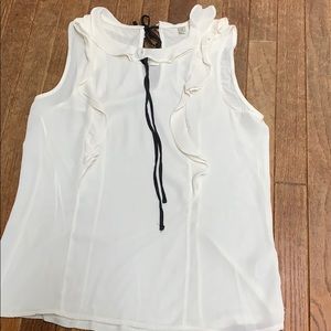 Cream sleeveless blouse